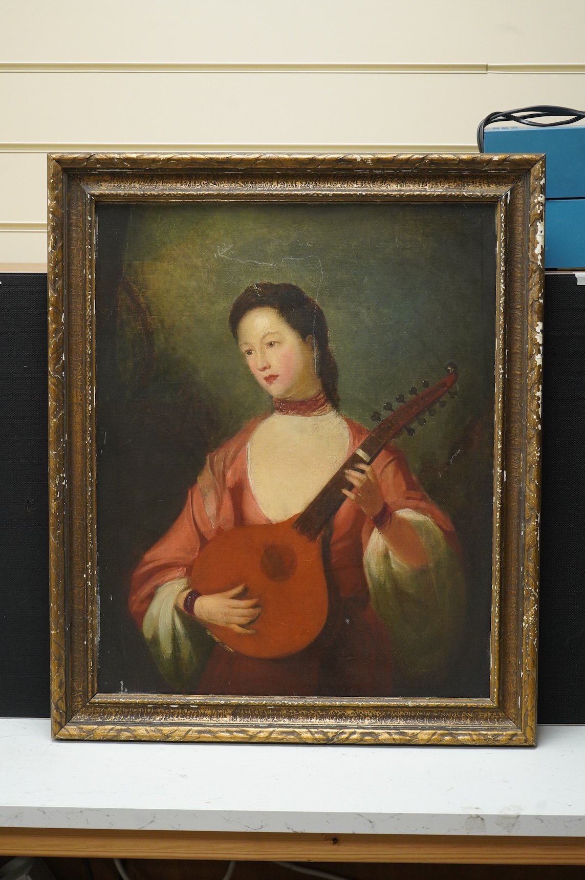18th/19th century school, 'Portrait of a lady playing the lute, oil on canvas, relined, 53 x 42cm